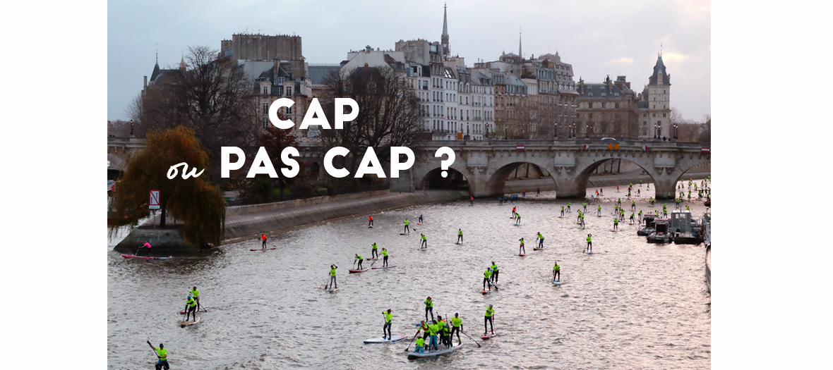 Course de paddle sur la Seine à Paris près de l'ile Saint-Louis