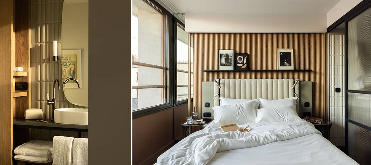 Chambre contemporaine avec tête de lit en bois et balcon avec vue sur Paris. Salle de bain design avec lumière tamisée.